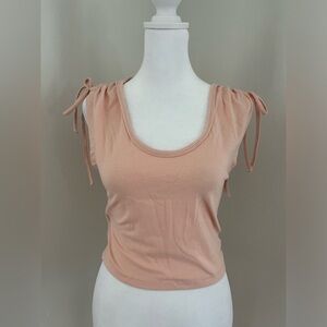 Light pink top with scrunch ties in shoulder